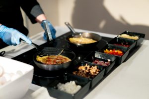chef is cooking corporate breakfast catering